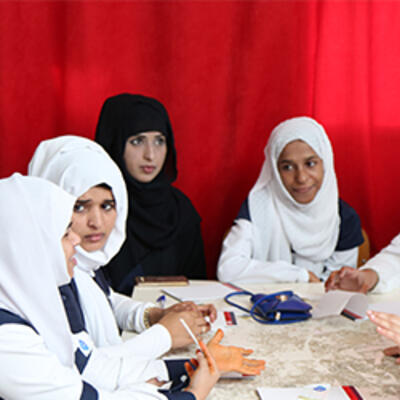 Young women engaged in life skills workshops